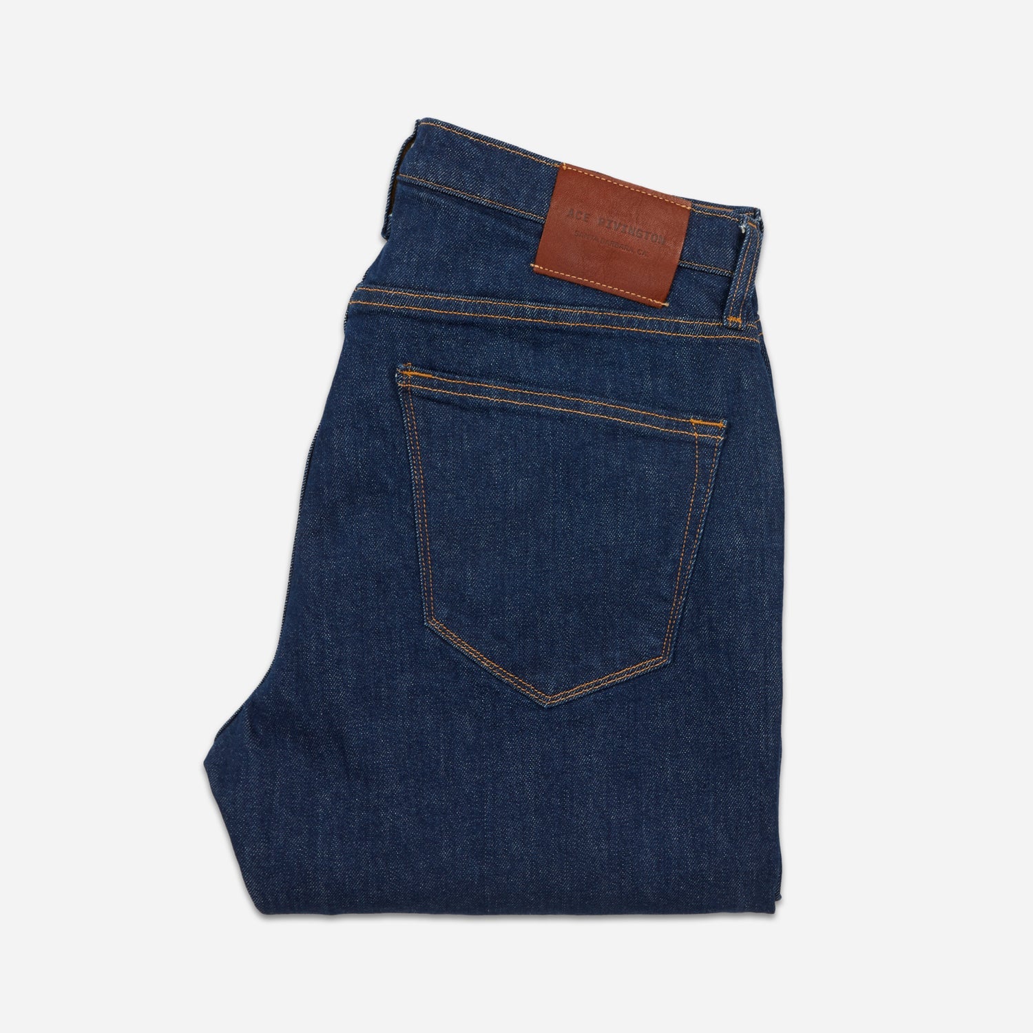 back of folded dark blue men's athletic taper jeans with no wear