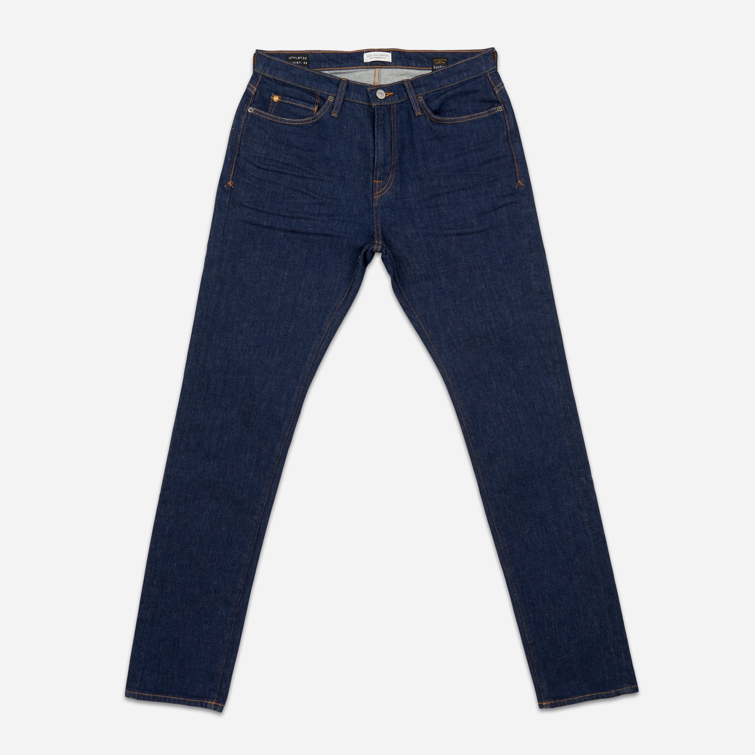 front of pair of dark blue men's athletic taper jeans with no wear and legs fully extended