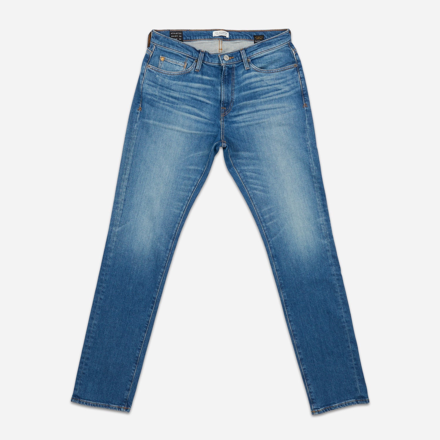 front of fully extended pair of men's athletic taper medium light blue jeans with slight wear 